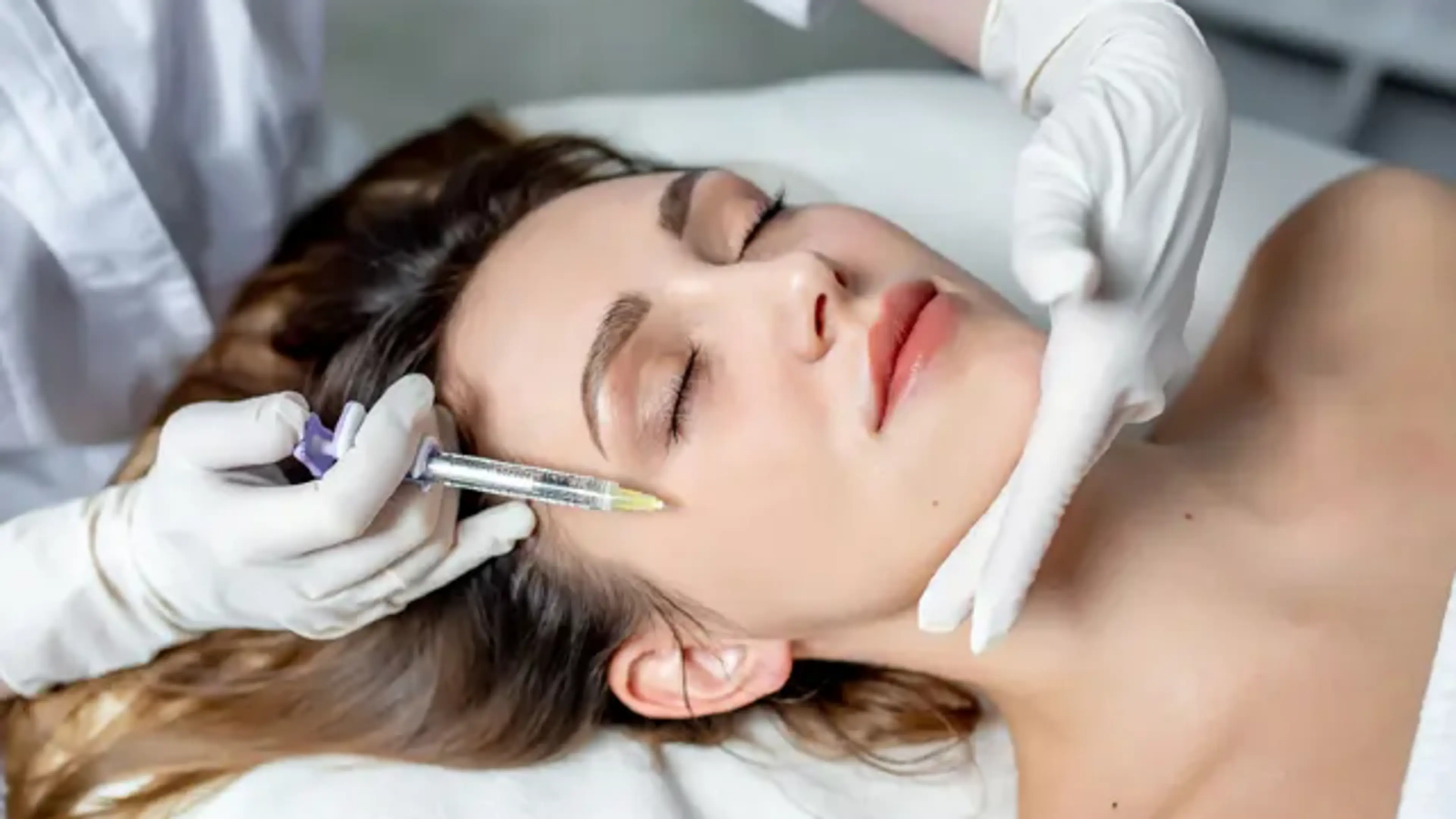 Skin booster injection treatment on woman’s face to improve hydration, elasticity, and overall skin rejuvenation in dermatology clinic