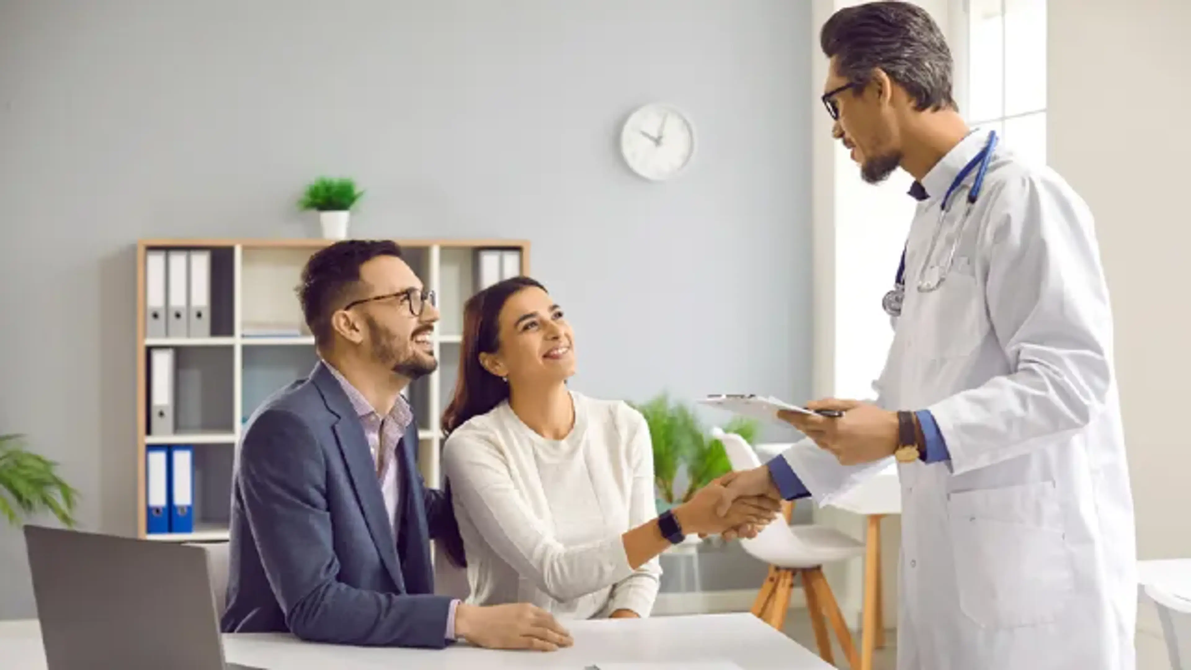 Doctor providing confidential sexually transmitted disease care consultation to adult patients